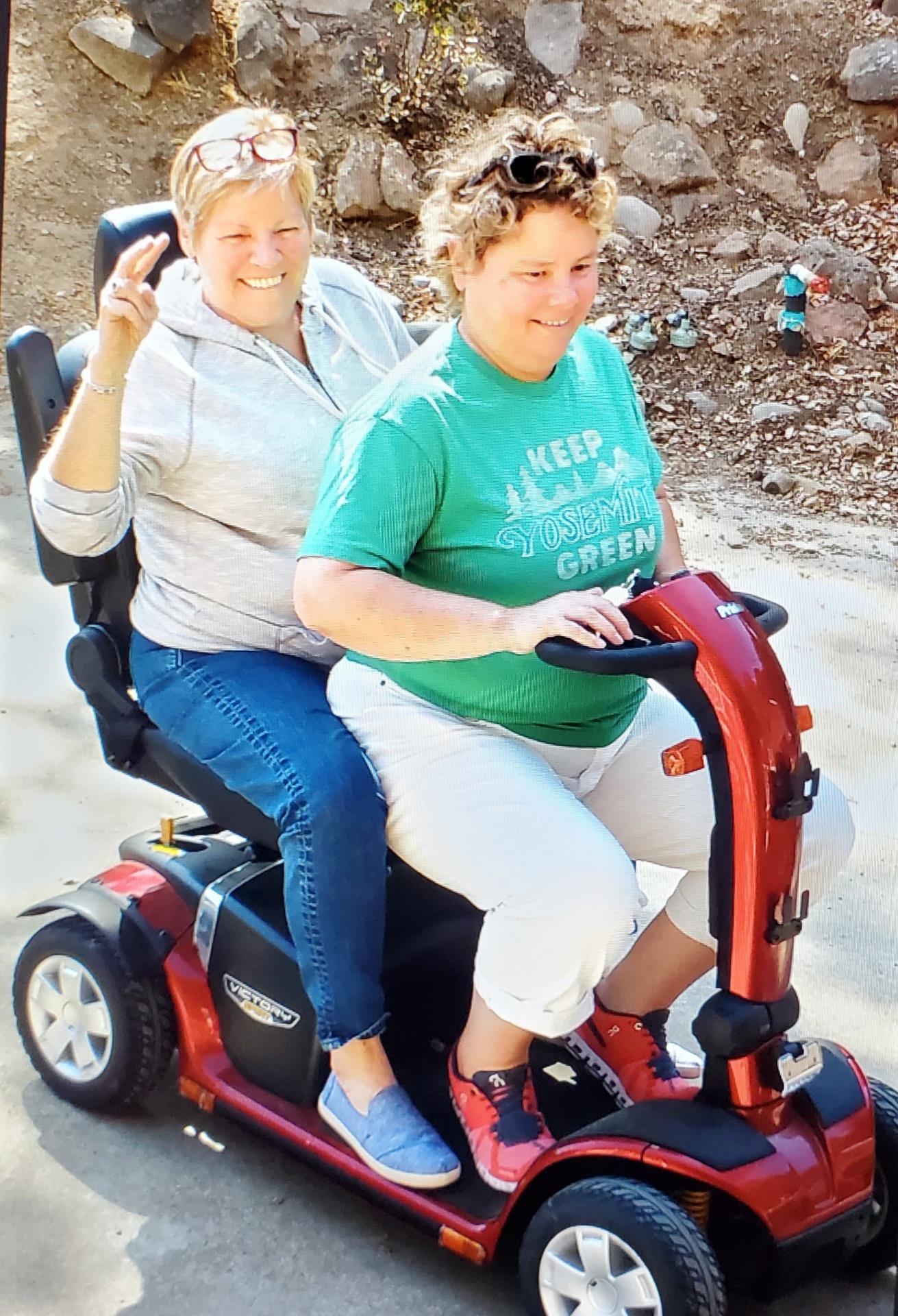 Two women on a scooter