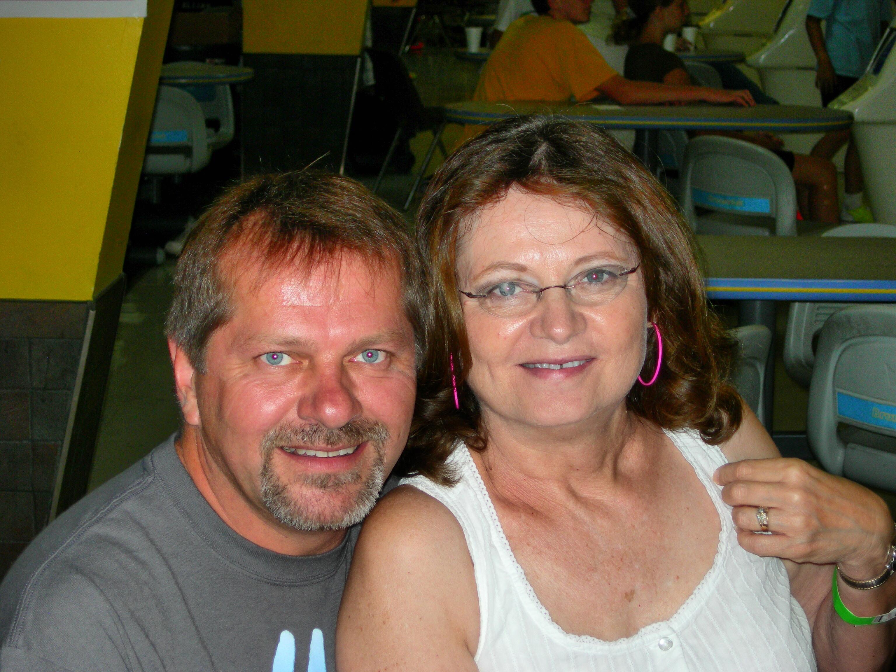 A man and woman smiling for a picture