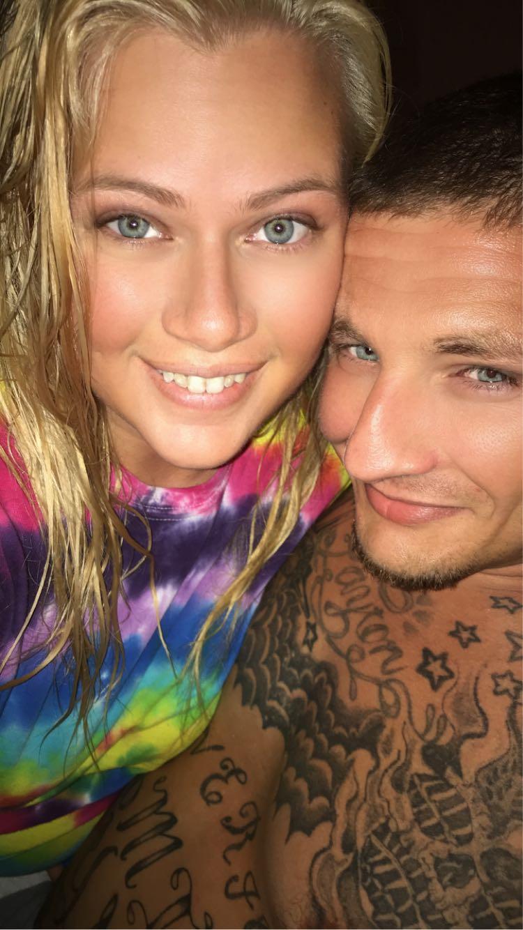 A man and woman taking a selfie