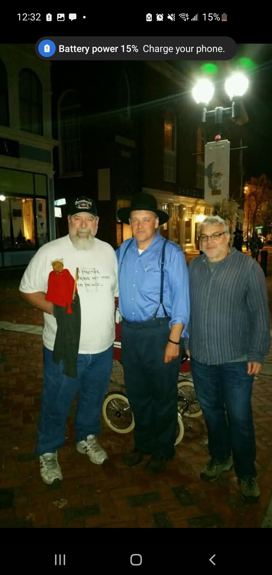 A group of men standing outside at night