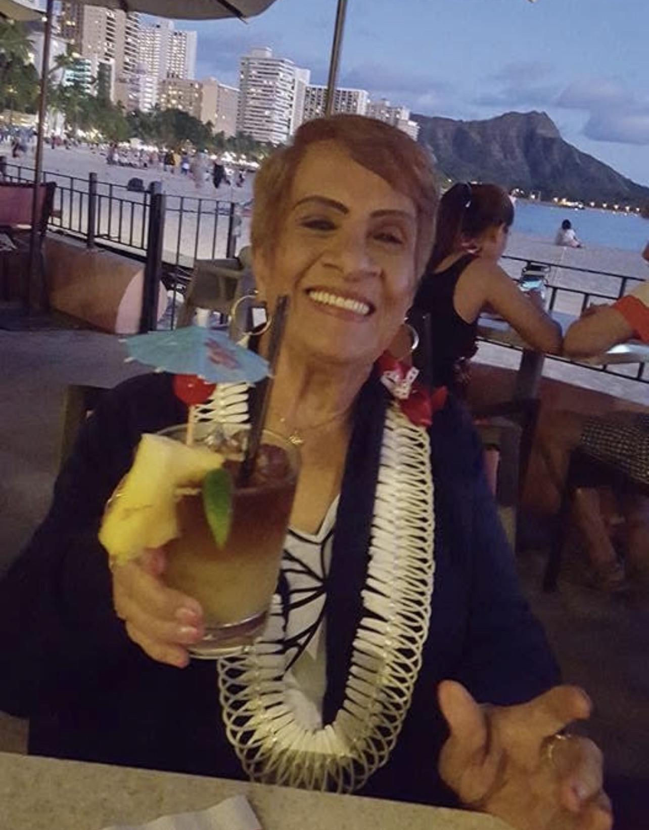 A woman holding a drink