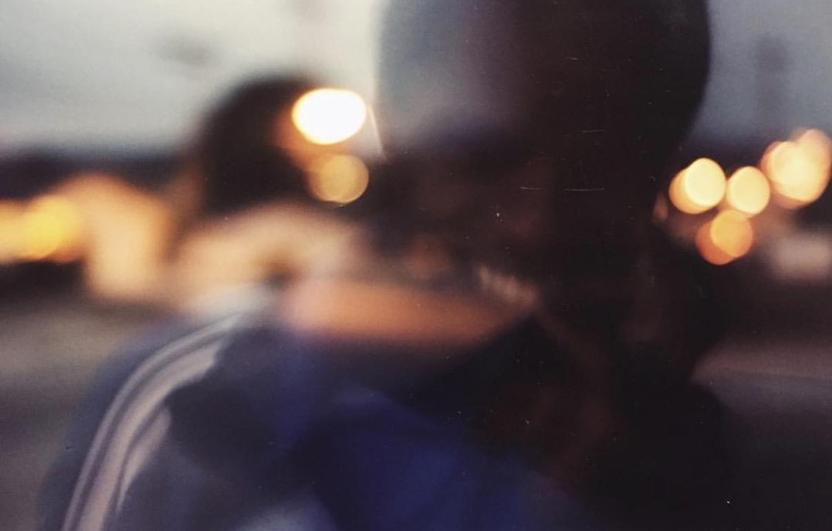 A blurry image of people in a car