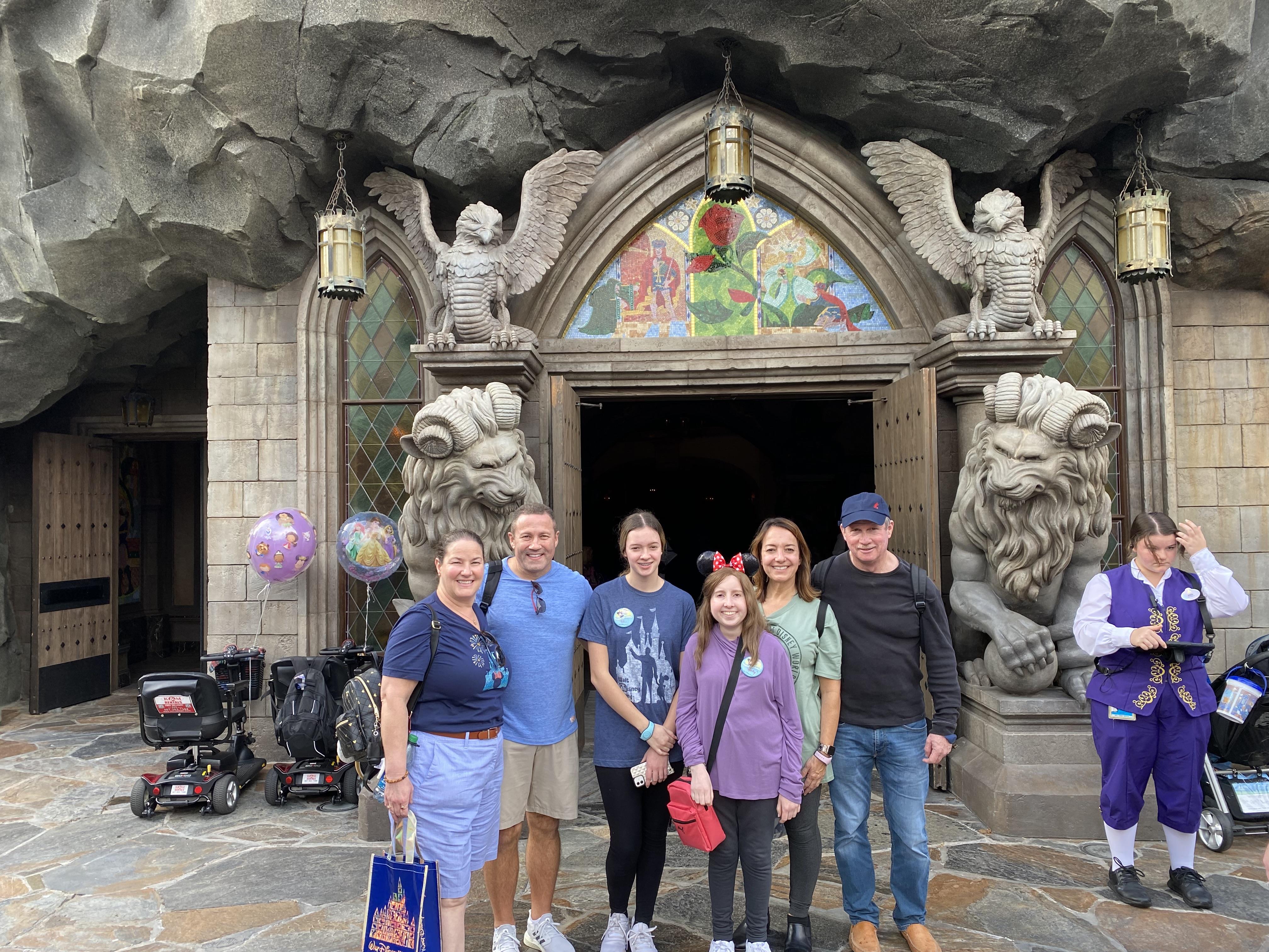 A group of people standing in front of a building