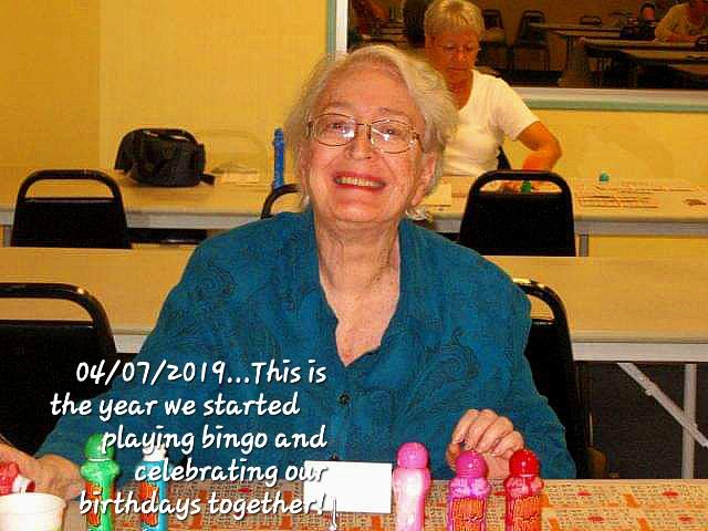 A group of seniors enjoys bingo and celebrates birthdays together at a community center.