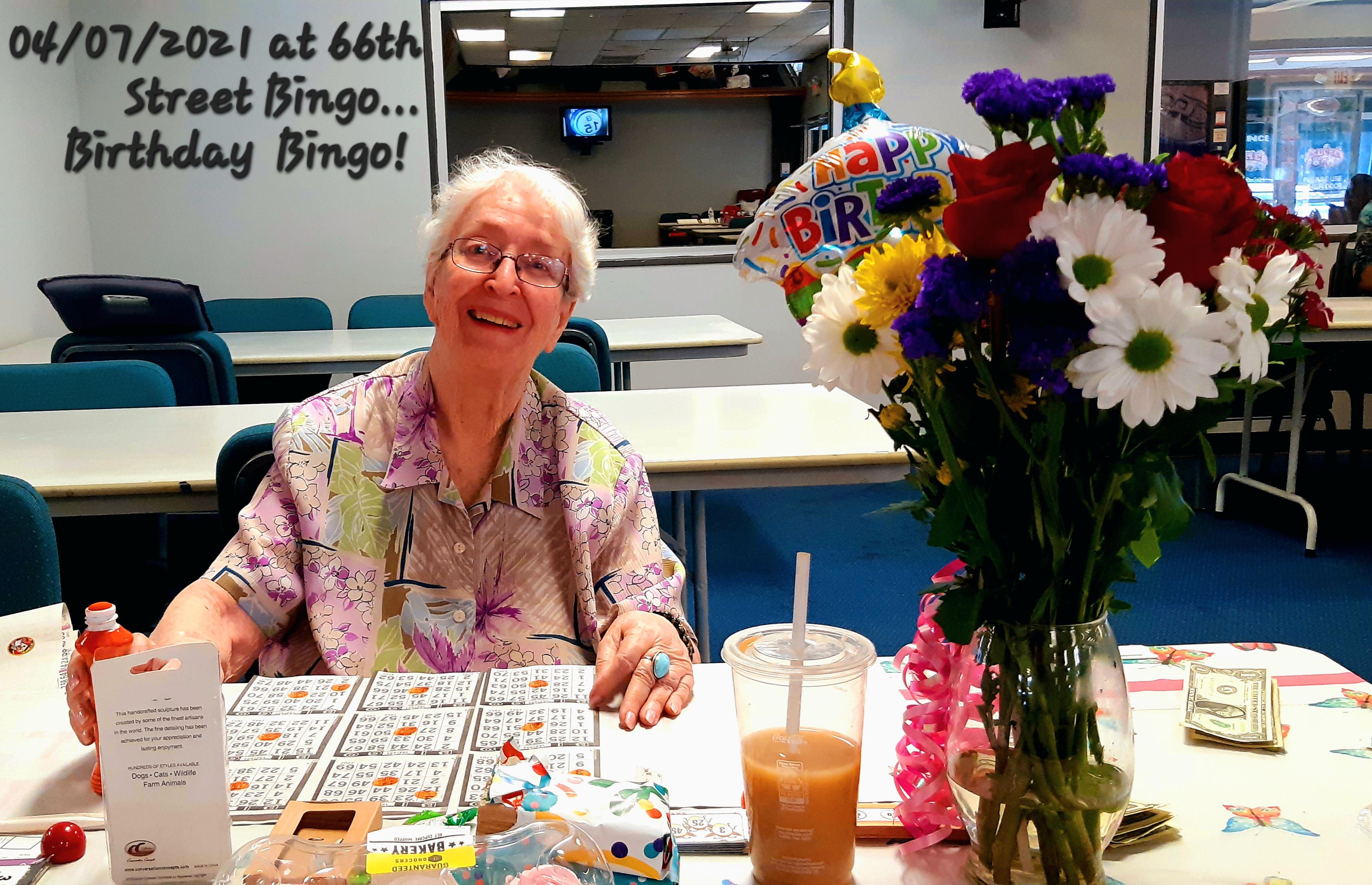 A woman plays bingo at a community center while celebrating her birthday with friends.
