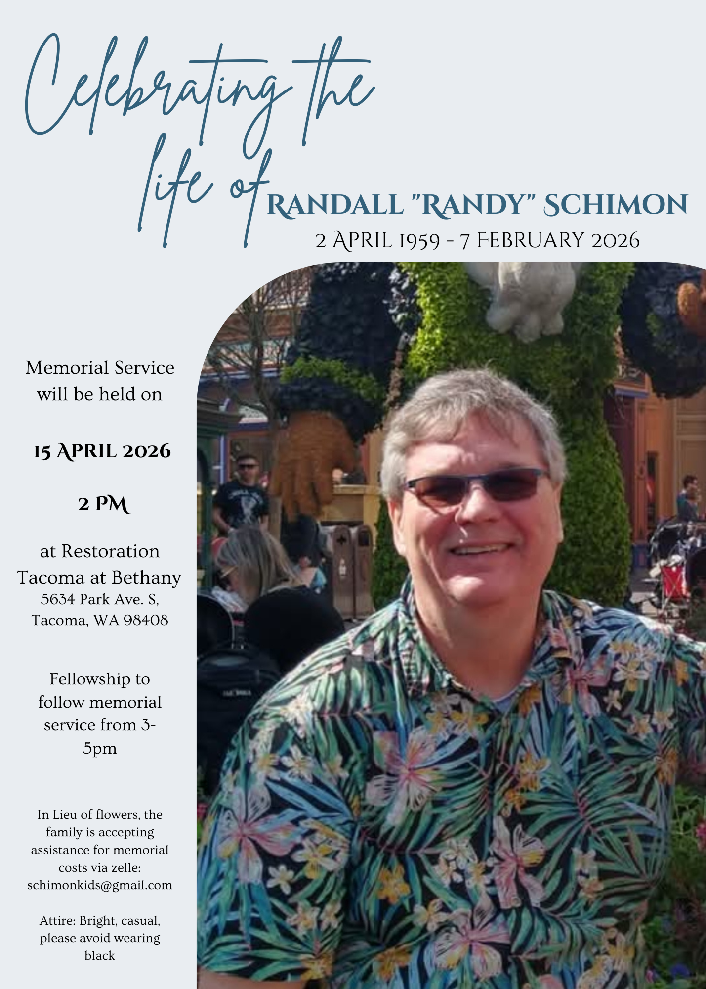 A man wearing sunglasses and smiling