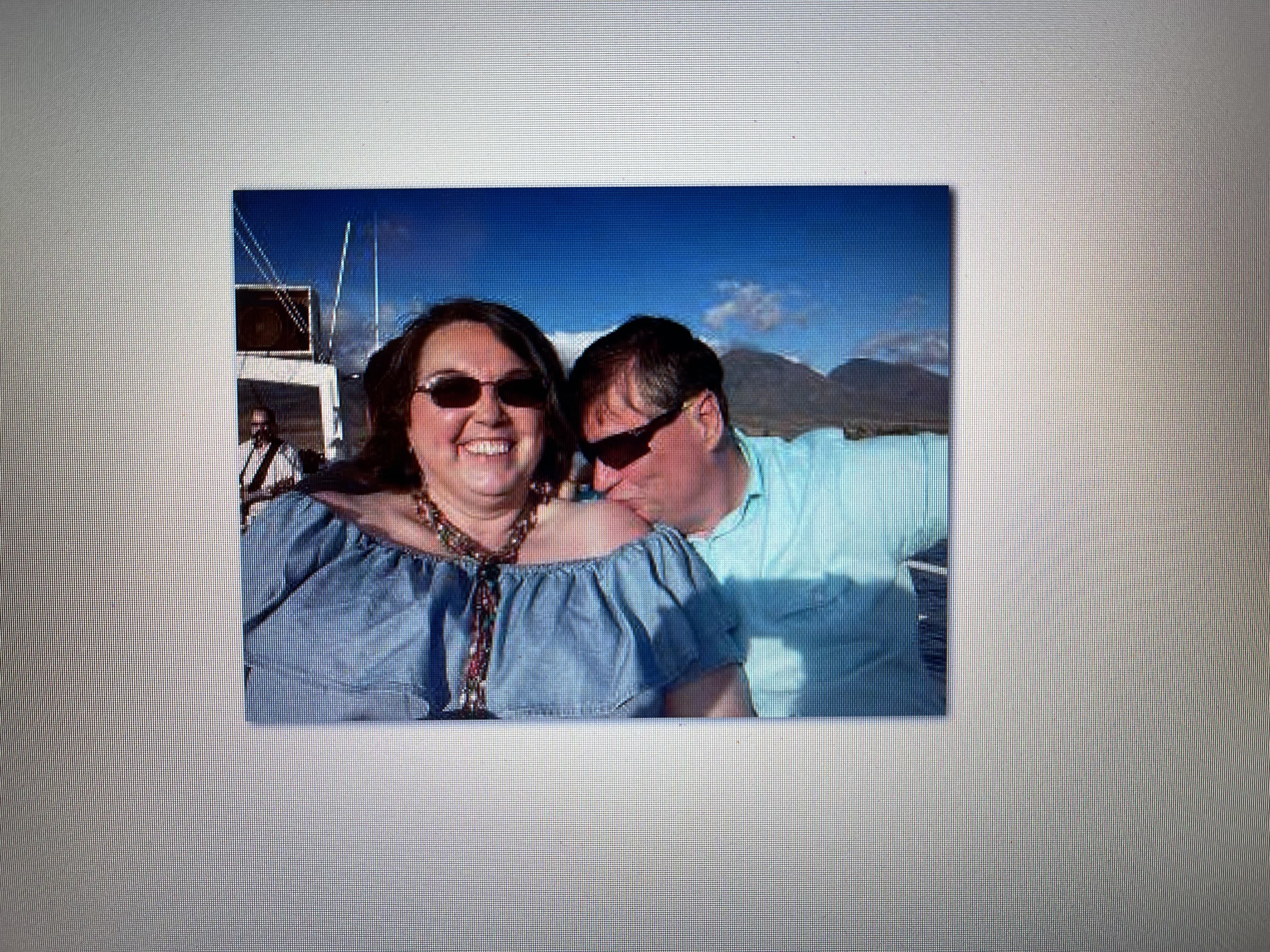 A man and woman posing for a picture