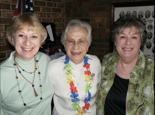 A group of women smiling for a photo