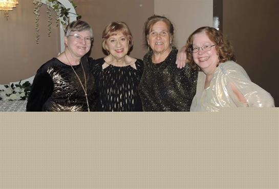 A group of women posing for a photo