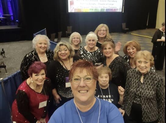 A group of women posing for a photo