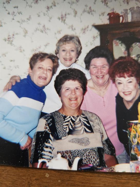A group of women posing for a photo