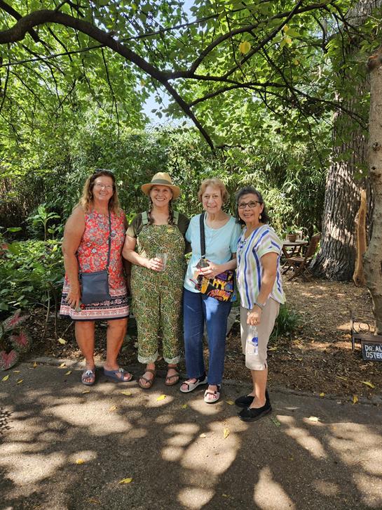 A group of women standing together outside
