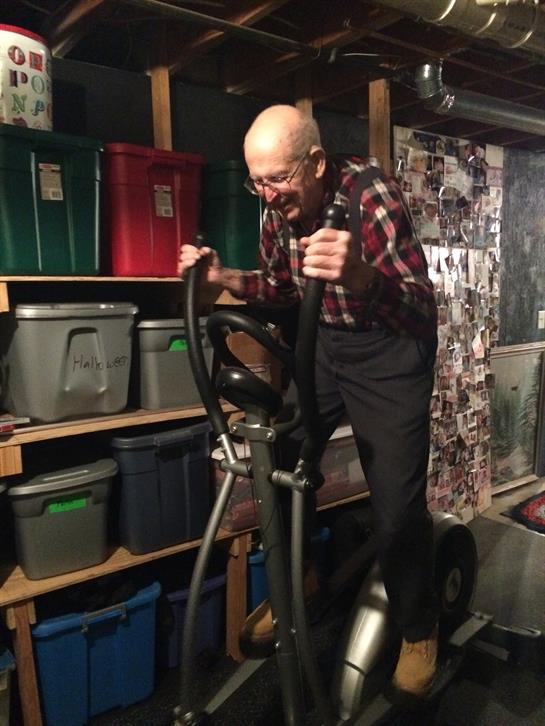 A man using an exercise bike