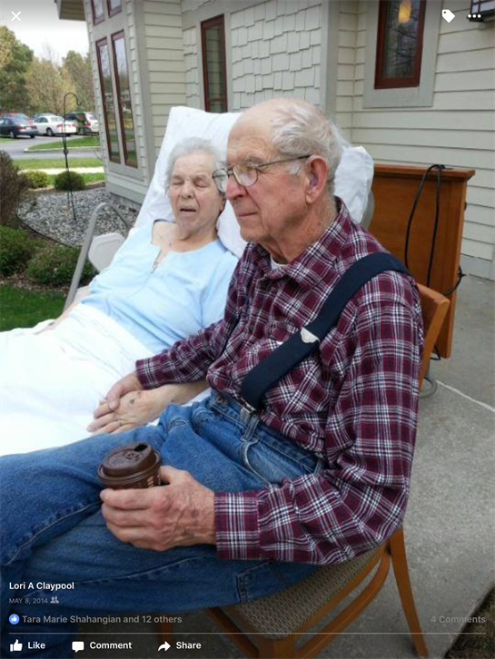 A man and woman in a hospital bed