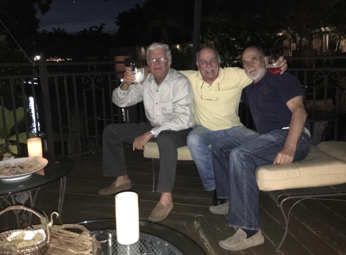 A group of men sitting on a bench