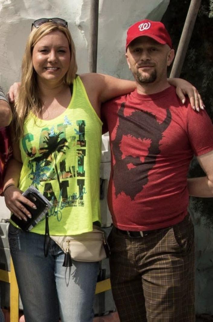 A man and woman posing for a picture