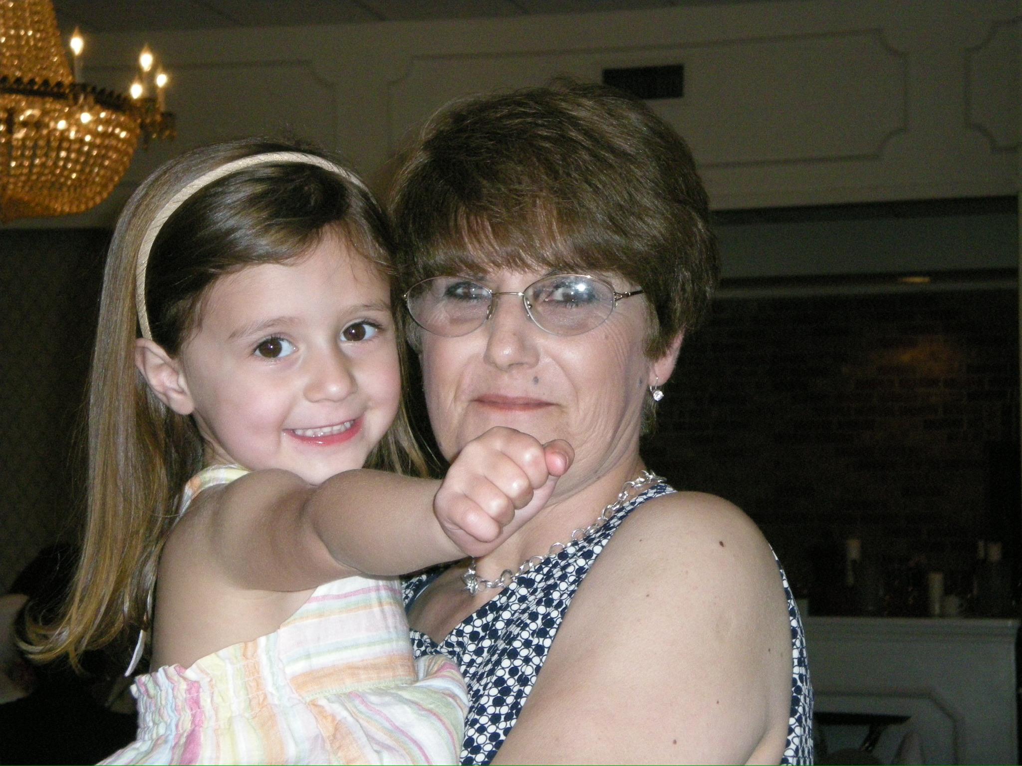 A woman holding a girl