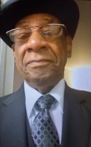 A man wearing a suit and tie