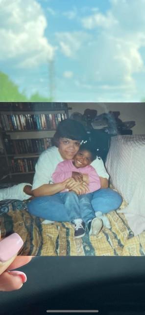 A woman and child sitting on a couch