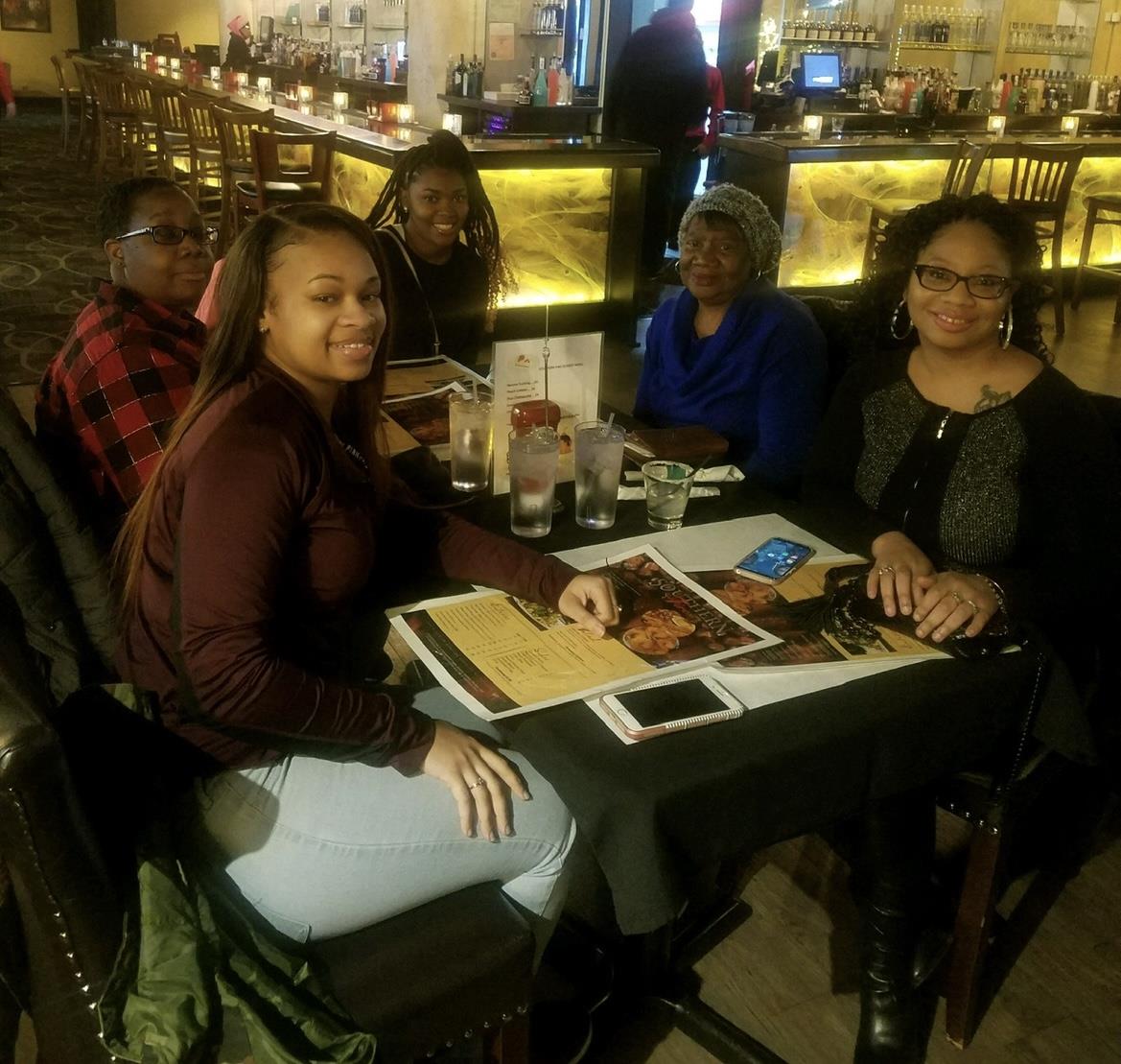 A group of people sitting at a table