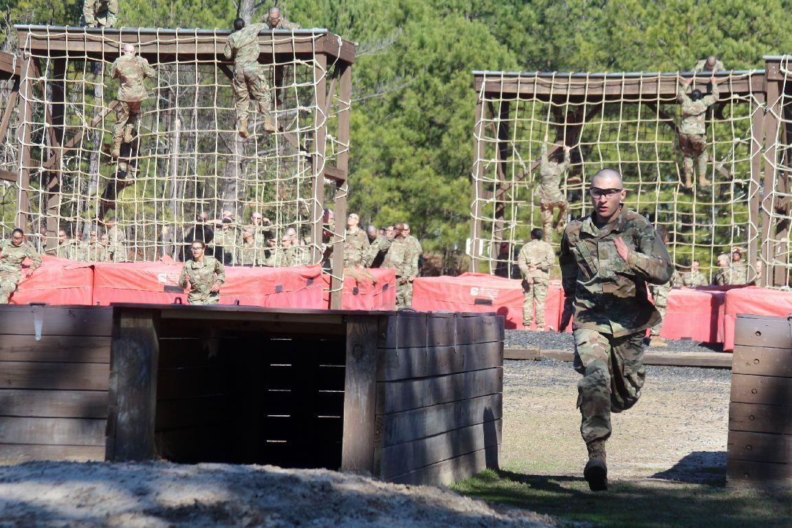 A soldier running in a obstacle course