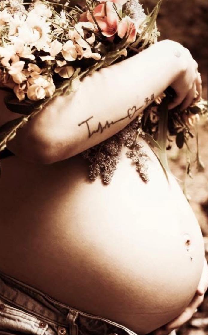 A close-up of a pregnant woman's belly