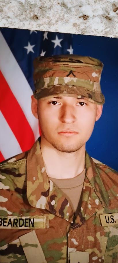 A man in camouflage uniform