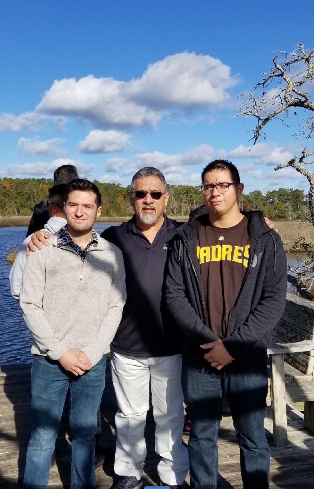 A group of men standing on a dock