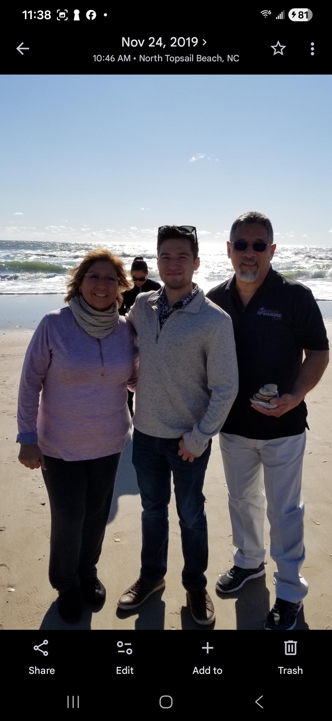 A group of people standing on a beach