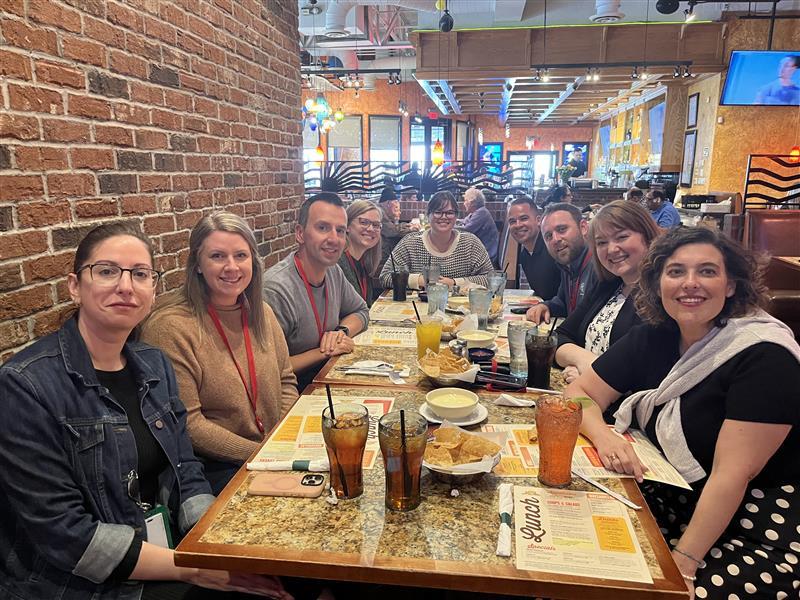 A group of people sitting at a table