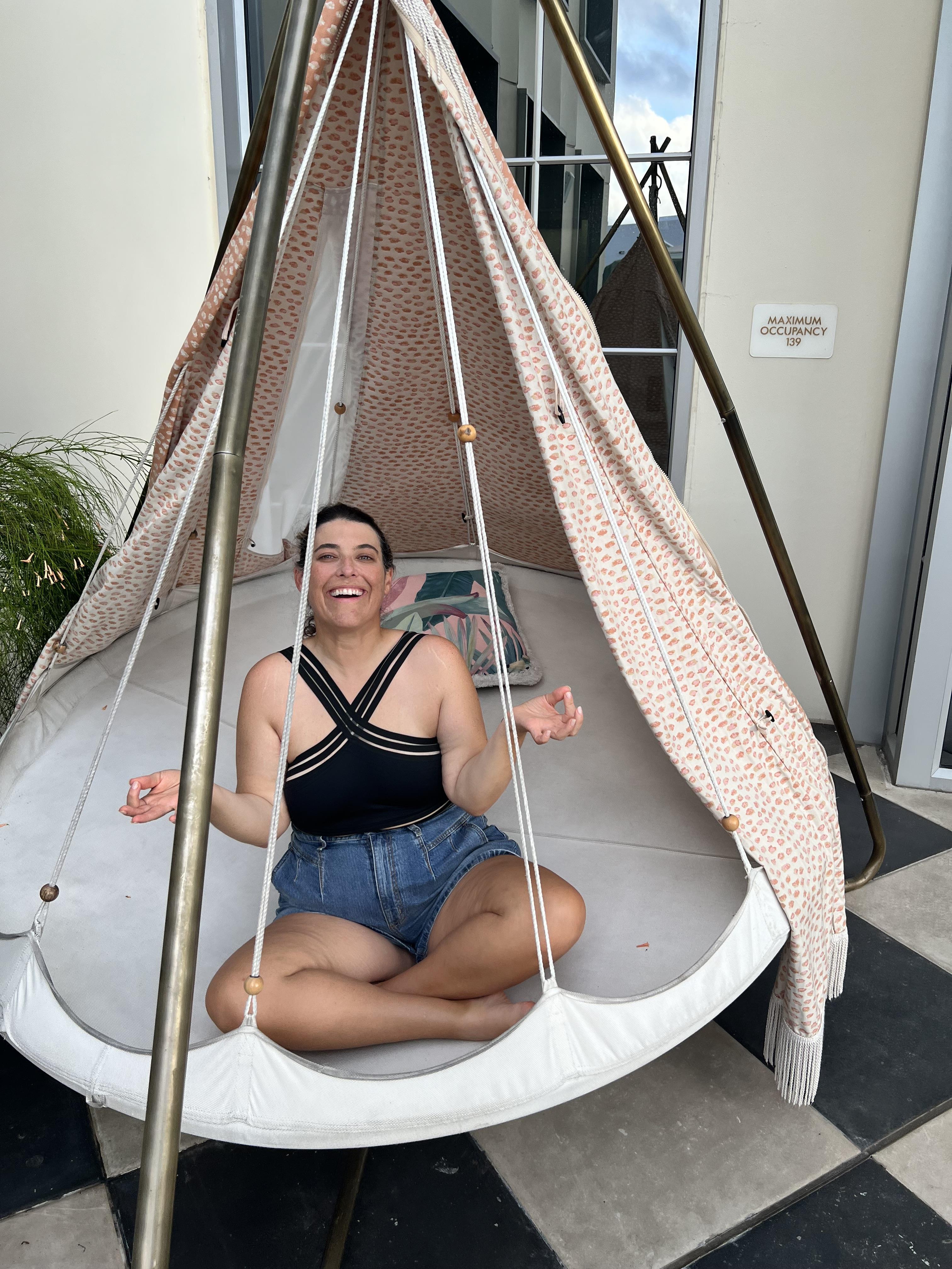 A woman sitting in a tent