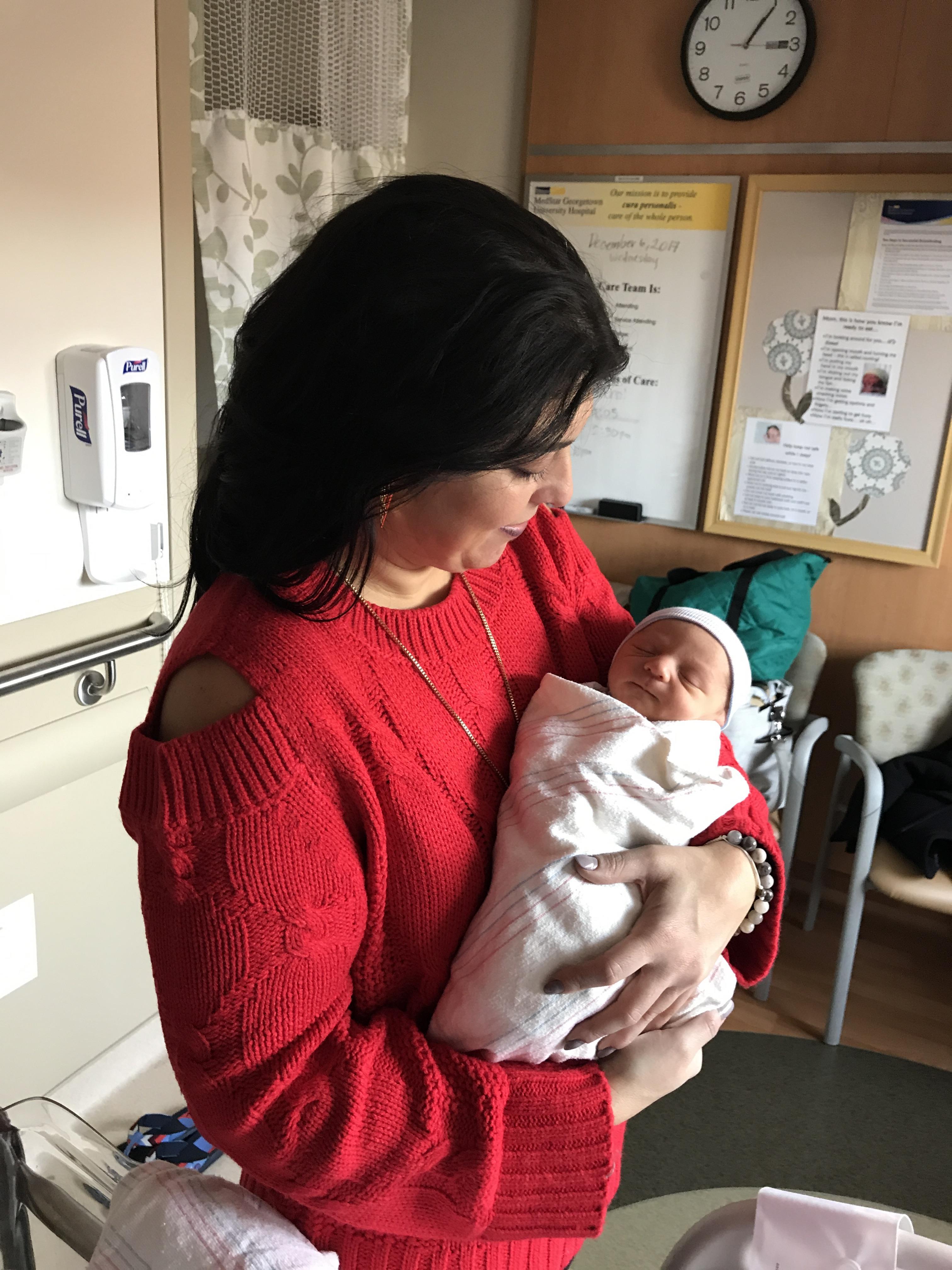 A woman holding a baby