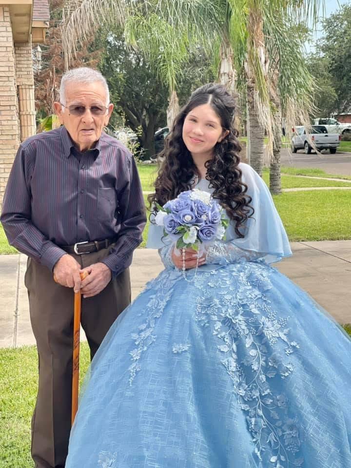 A man and woman in a blue dress