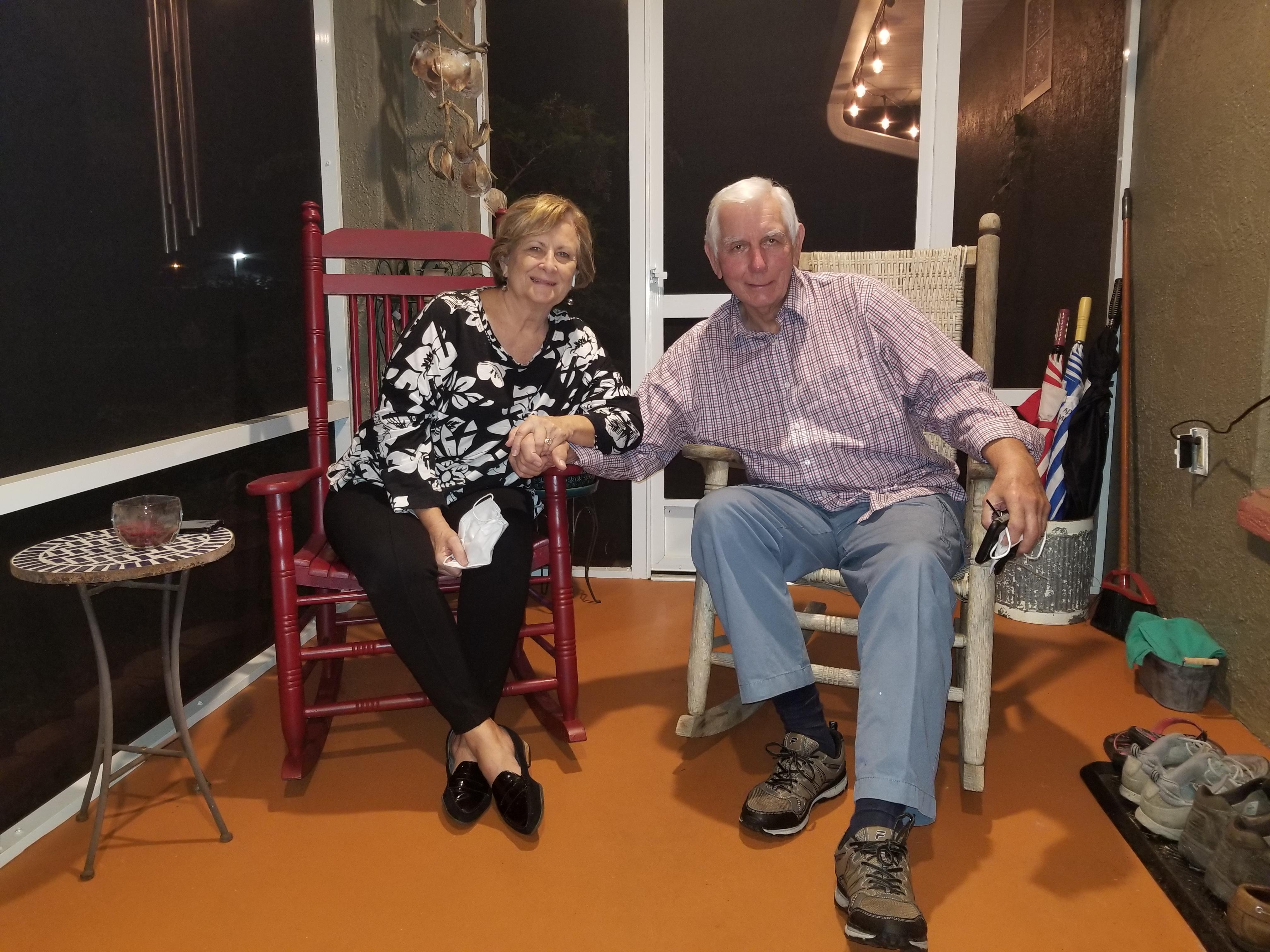 A man and woman sitting in rocking chairs