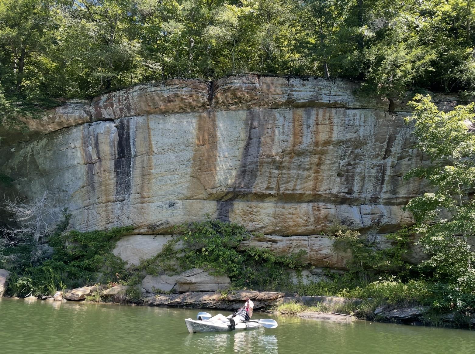 A person in a boat on a lake