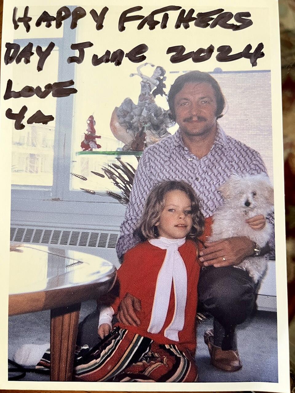 A man and a girl posing for a picture