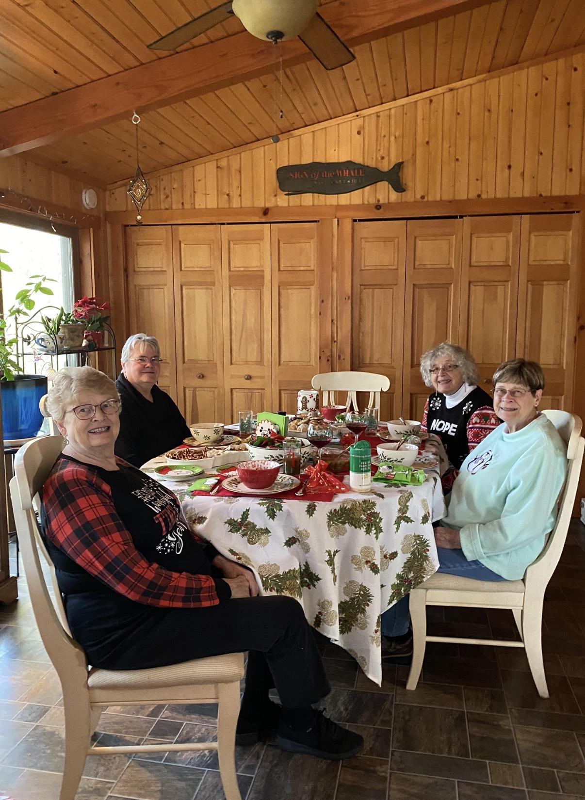 A group of women sitting at a table