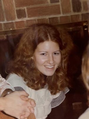 A woman smiling at camera