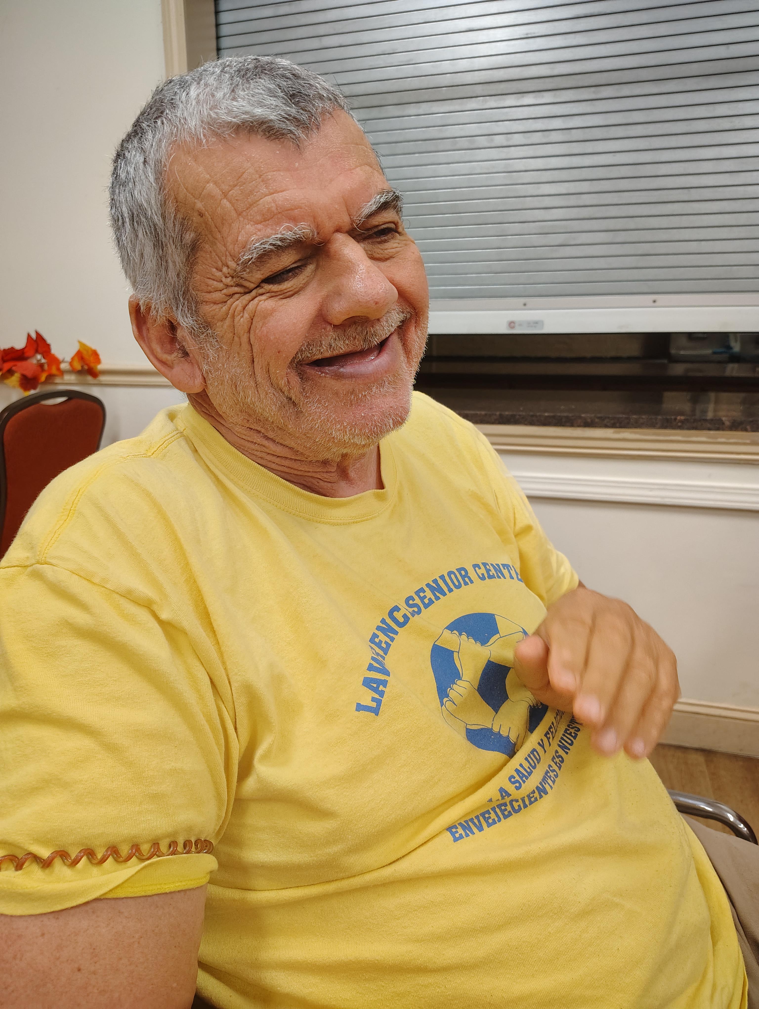 A man in a yellow shirt