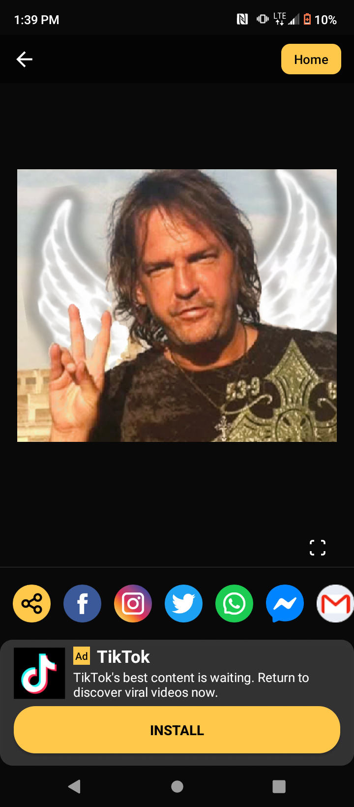 A screenshot of a man with a peace sign