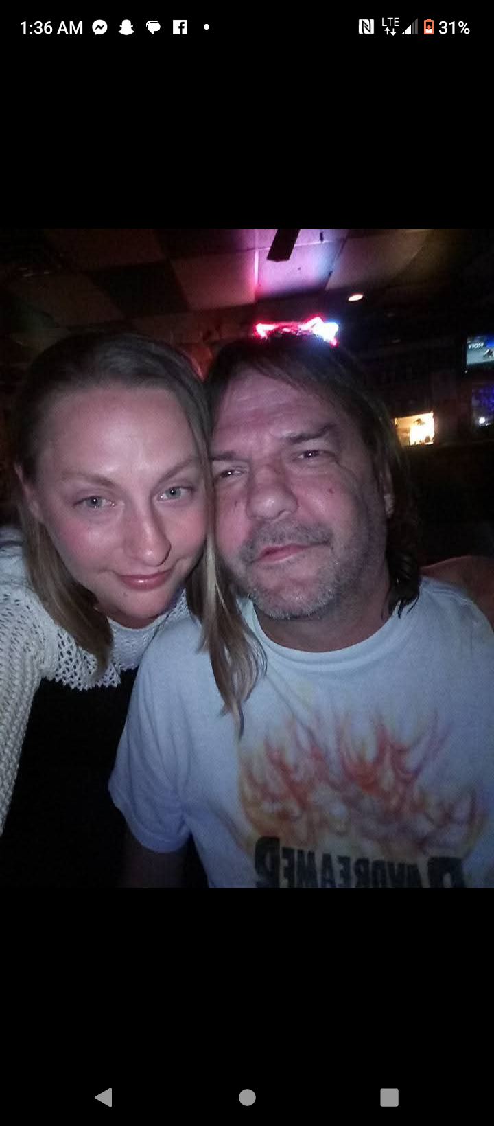 A man and woman taking a selfie
