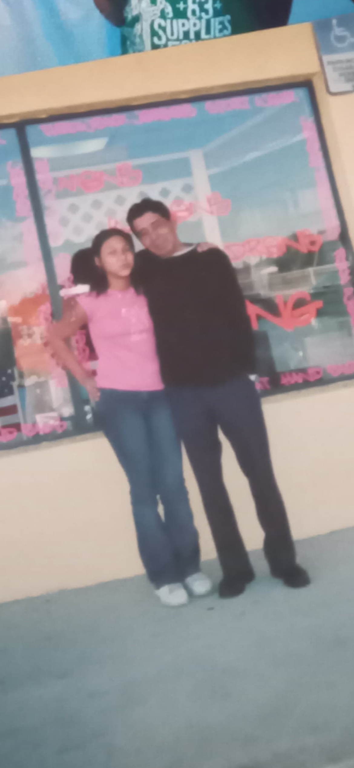 A man and woman posing for a picture