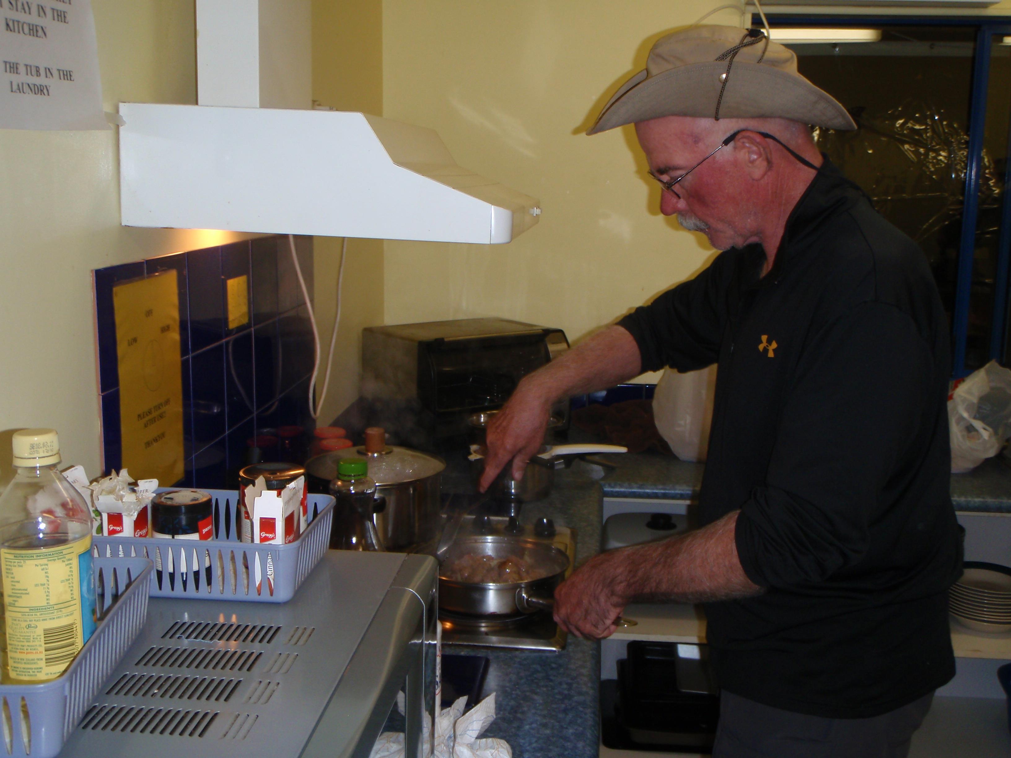 A man cooking in a kitchen