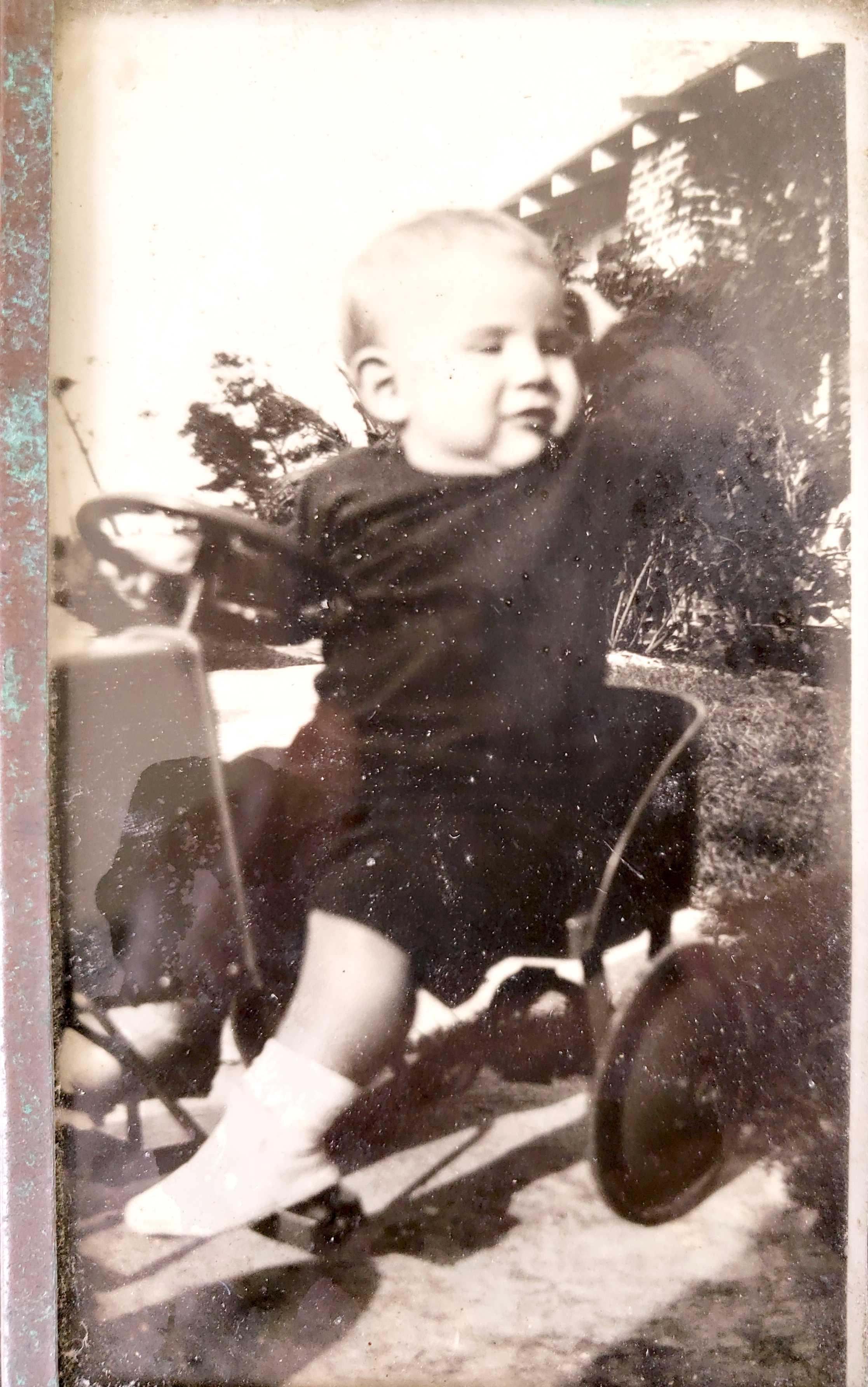 A baby in a toy car