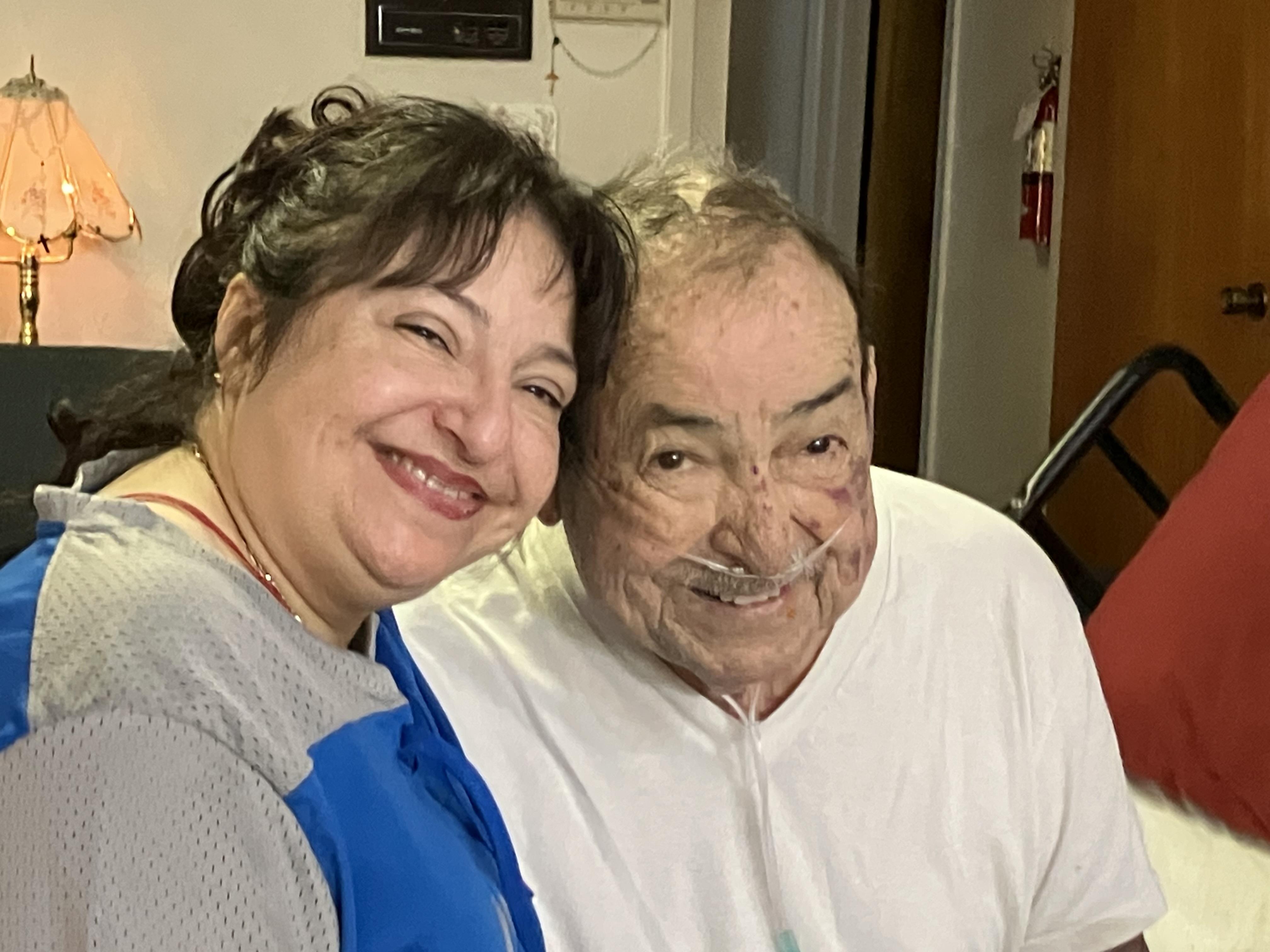 A woman smiling next to a man