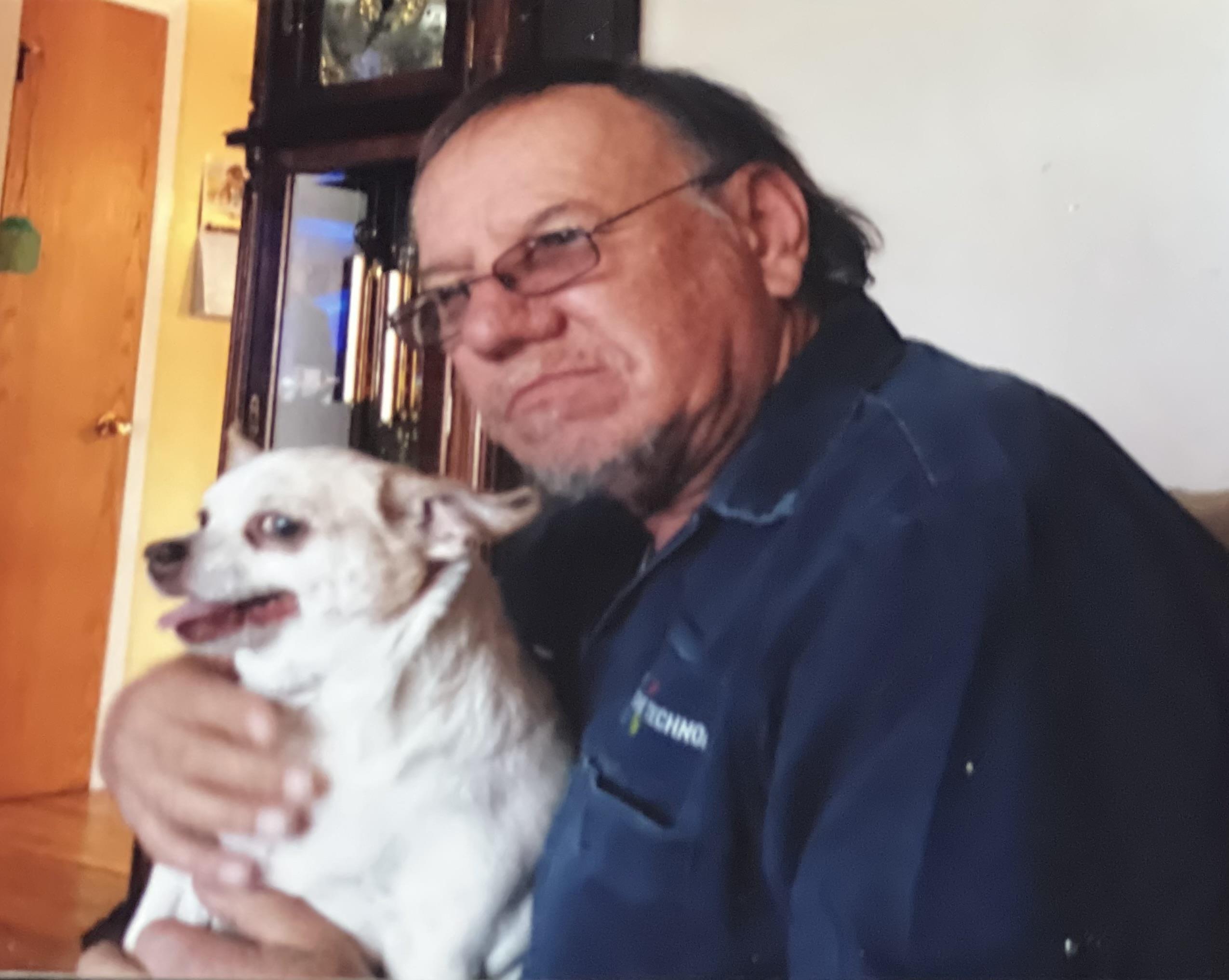 A man holding a dog