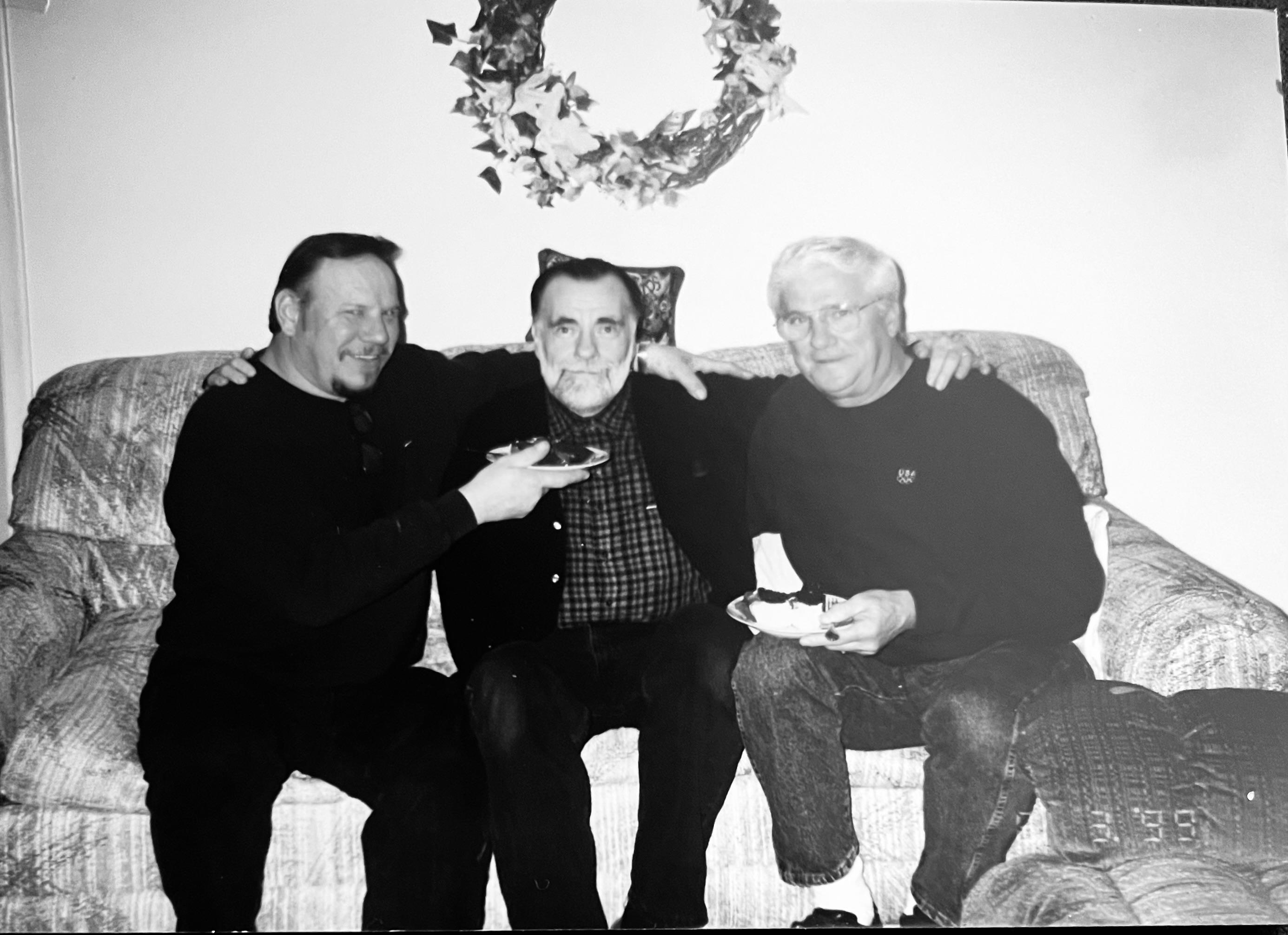 A group of men sitting on a couch