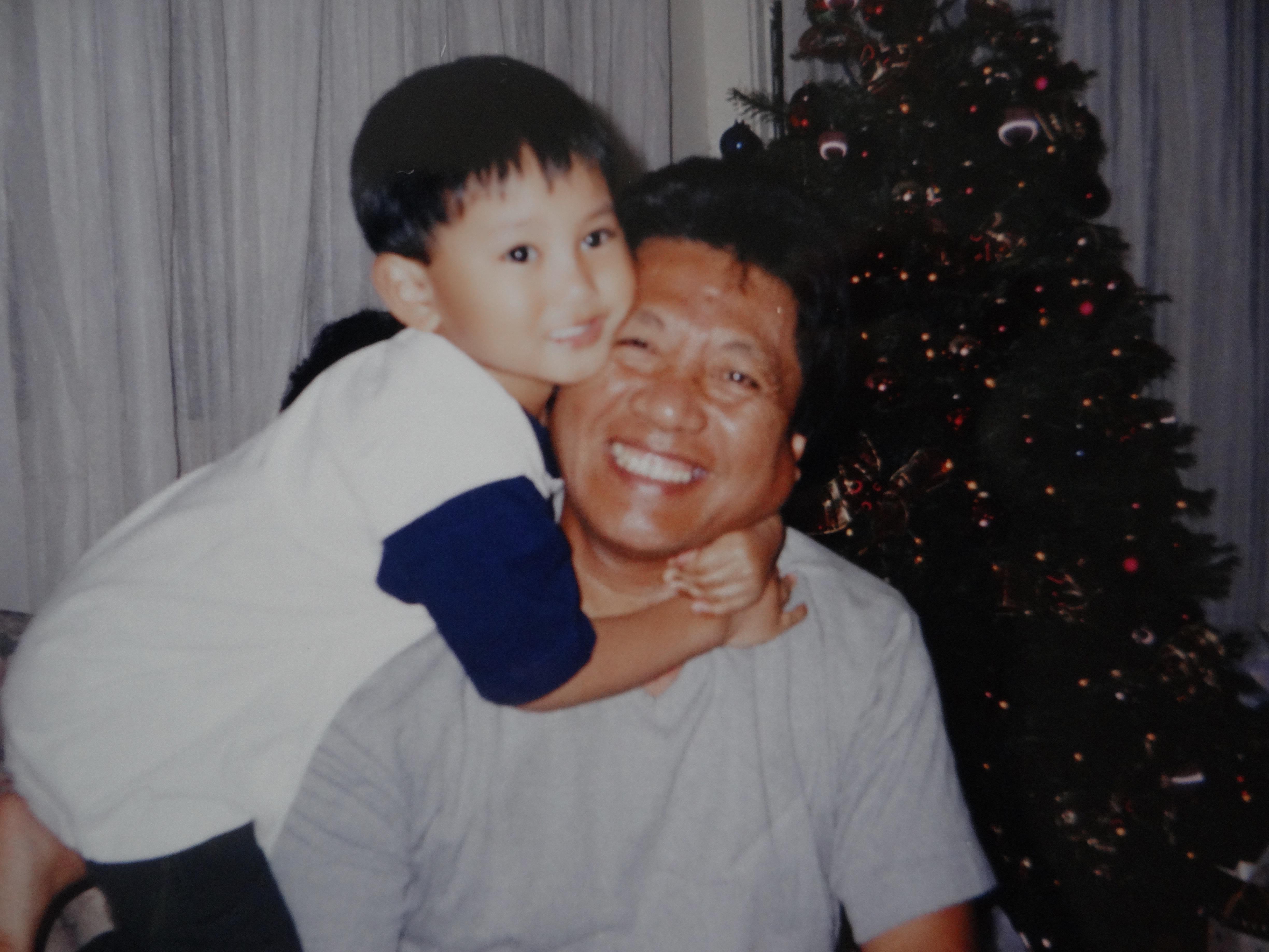 A man holding a child on his shoulders