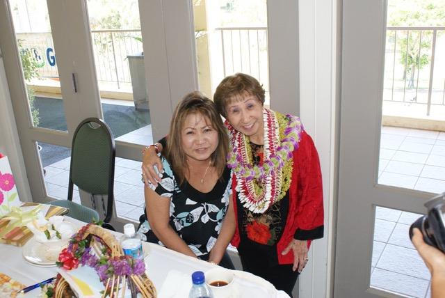 A couple of women posing for a photo