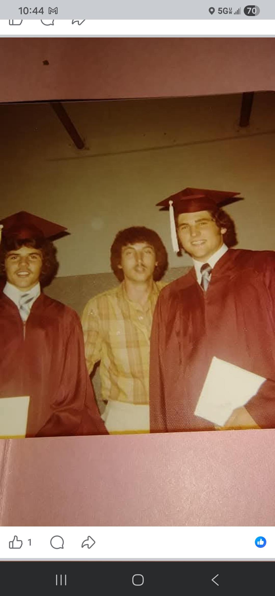A group of men in graduation gowns